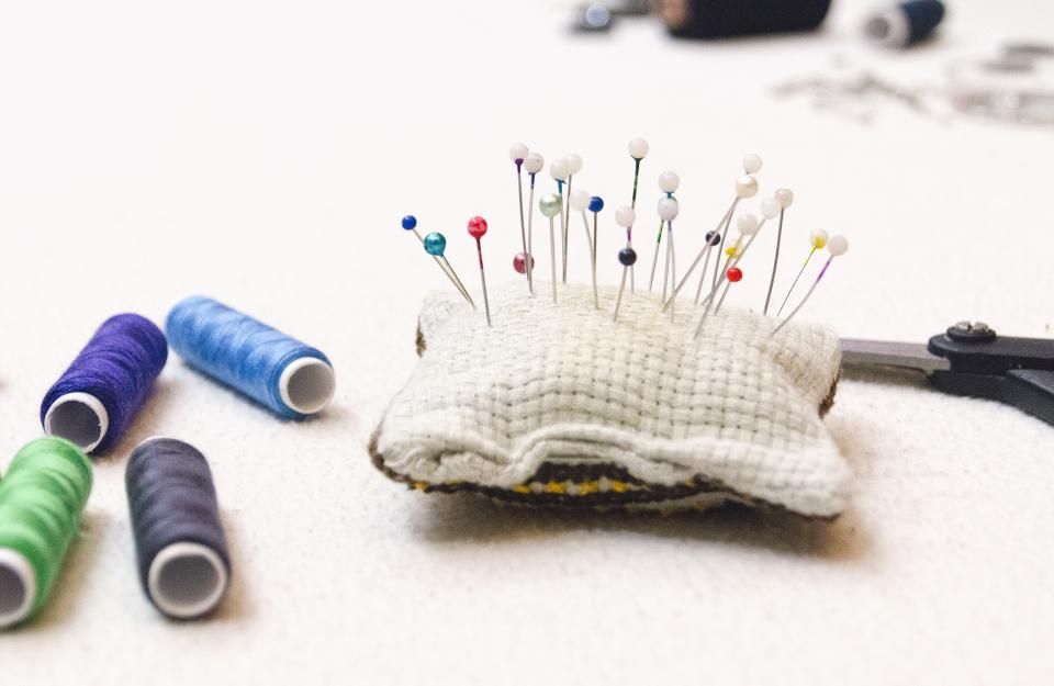 Pincushion and thread spools